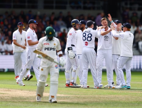 Ollie Robinson of England celebrates taking the wicket of Abdullah Shafique of Pakistan with their team-mates