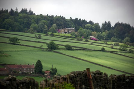 A handful of houses nestled in moorland fields