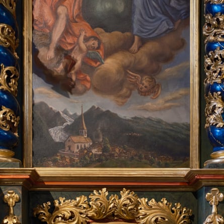 A baroque-style painting of Jesus and angels above a white church with a glacier in a valley and snow-clad peaks in the background