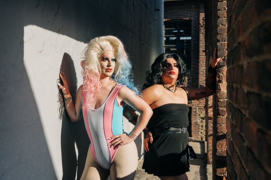 two drag queens pose