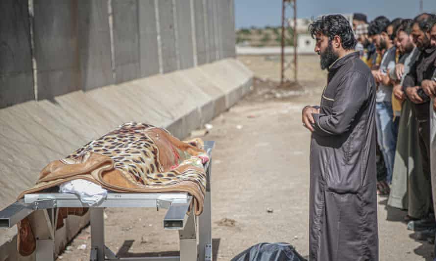 Mourners at a funeral for Syrian children Nur al-Omar and Iman al-Omar who were killed in the attacks by Bashar al-Assad’s forces in the Syrian province of Idlib.