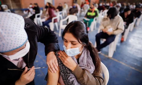 A person receives the vaccine against Covid-19, in the Club Fomento de Barrio Obrero in Asuncion, Paraguay, 21 July.