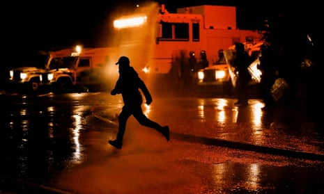 Police use water cannon during protests in Belfast, Northern Ireland, 8 April 2021
