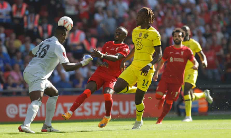 Chelsea goalkeeper Edouard Mendy gets to the ball first ahead of Liverpool’s Sadio Mane (centre) and heads clear as Chelsea’s Trevoh Chalobah looks on.
