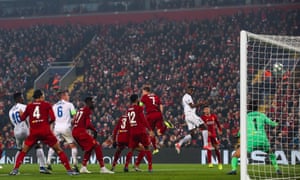 Mbwana Samatta powers in a header.