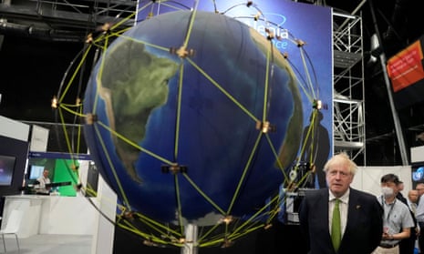 Boris Johnson next to a massive globe