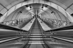 Empty underground escalators await the morning rush hour