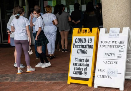 People arrive to receive Covid-19 vaccinations at a vaccination clinic in Fairfax, Virginia.