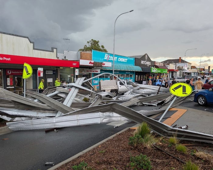 NSW storms leave man dead and thousands without power as temperatures soar into 30s
