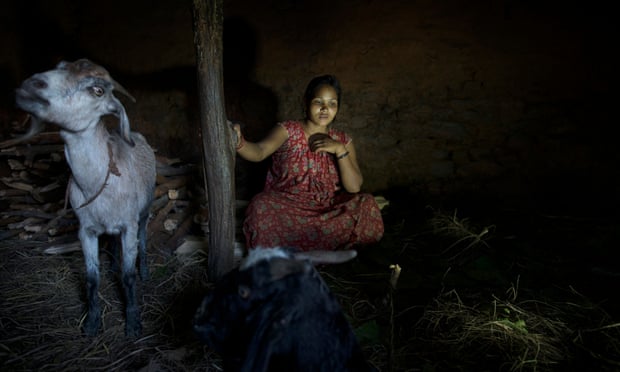 Laxmi Tamatta, aged 20, sits in a chhaupadi shed in Acham district, Nepal