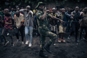 Goma, the Democratic Republic of the Congo. A soldier leads a session to enrol new recruits into the army as the fighting continues against a rebel military group the M23 Movement