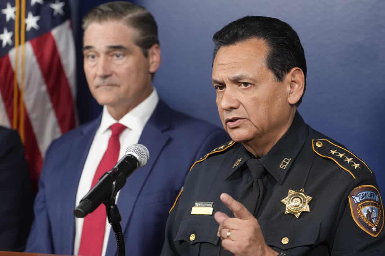 Harris County Sheriff Ed Gonzalez speaks at a microphone beside District Attorney Sean Teare
