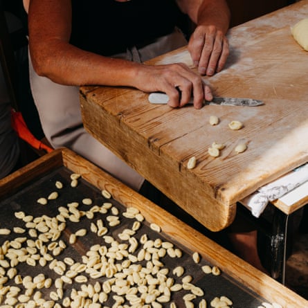 A woman making pasta