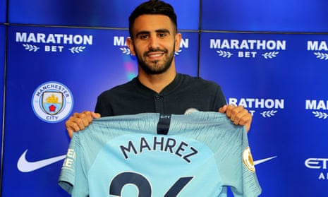 Riyad Mahrez, Manchester City’s £60m signing, holds up his No26 shirt. 