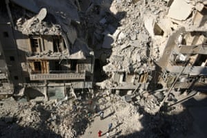 People dig in the rubble in a search for survivors after an airstrike
