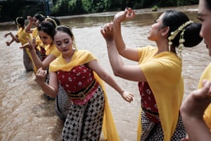 Dancers perform in the Progo River