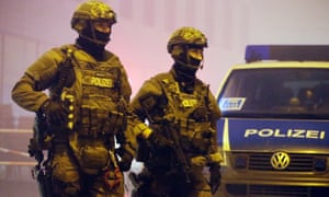 Armed police patrol outside Pasing railway station in Munich on Friday after intelligence reports warned of a string of suicide bomb attacks on city stations.