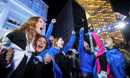 Supporters of the Georgian Dream party celebrate after the announcement of exit poll results in Tbilisi.