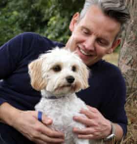 BorrowMyDoggy member Ziggy the cavachon and his borrower, Chris