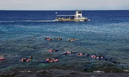 Tourists on a snorkelling excursion off Liuqiu island, Taiwan, 5 August 2022.