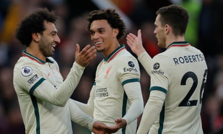 Mo Salah celebrates with Trent Alexander-Arnold and Andy Robertson after putting Liverpool 4-0 up in added time at the end of the first half.