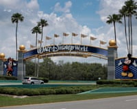 a car driving by a sign