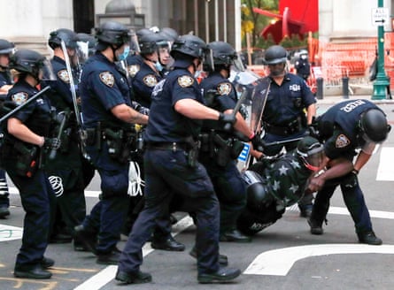 NYPD officers detain a demonstrator in July last year.