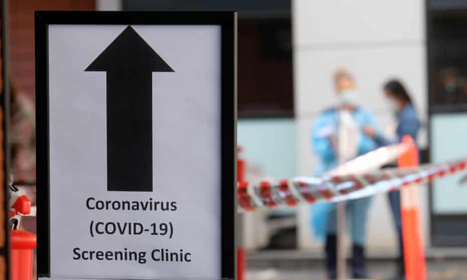 A sign directing people to the coronavirus screening area at Royal Melbourne hospital