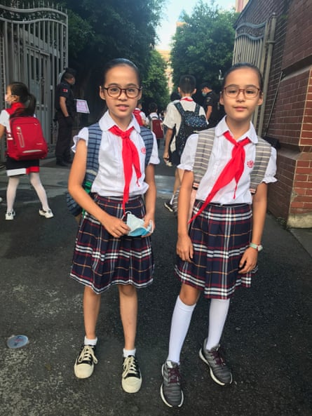 Ariel, left, and Natasha at the school gates.