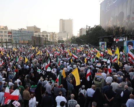 People gather in Tehran’s Revolution Square for a ‘victory celebration’ organised by the authorities People gather in Tehran’s Revolution Square for a ‘victory celebration’ organised by the authorities