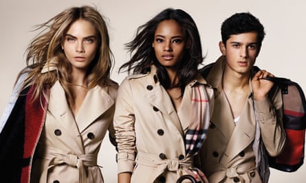 Burberry’s trademark macs modelled by Cara Delevingne, Malaika Firth and Tarun Nijjer (alligator version not pictured).