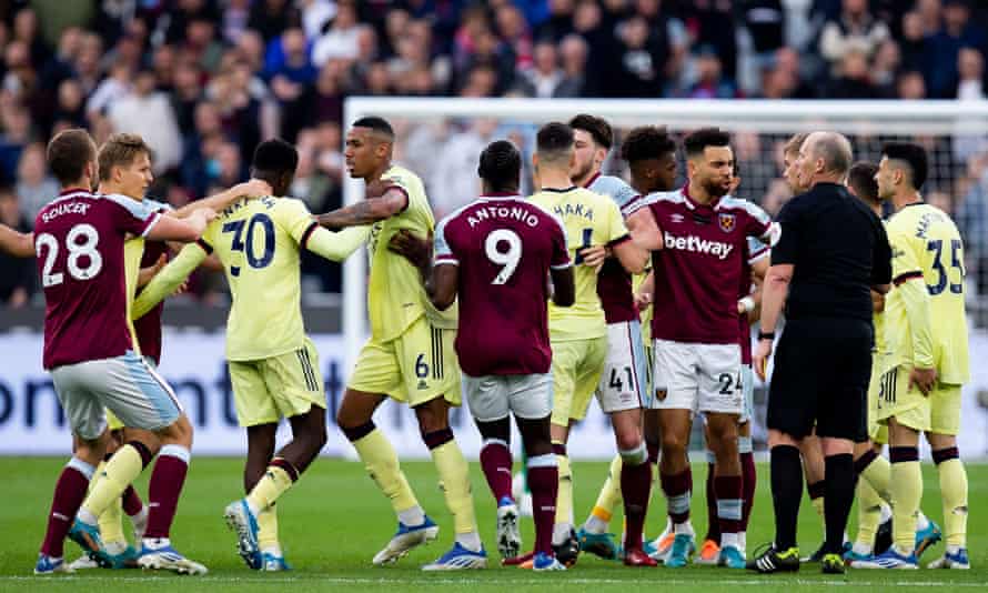 Players from West Ham and Arsenal argue after an incident near the end of the match at the London Stadium.
