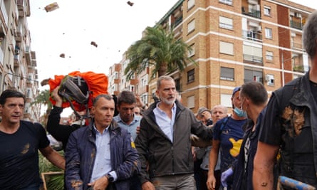 Mud and objects being hurled at King Felipe (centre-right) during his visit to Paiporta on 3 November.