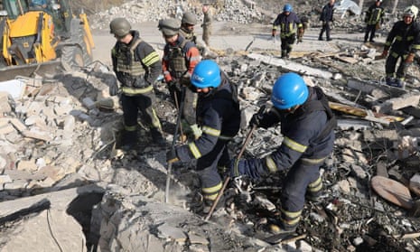 Emergency workers search the victims of the deadly Russian rocket attack that killed more than 50 people in the village of Hroza near Kharkiv, Ukraine, Thursday, 5 October 2023.