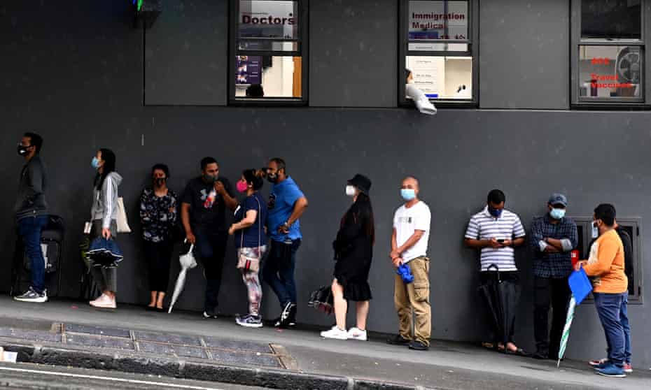 New Zealanders queue for a Covid test in Auckland