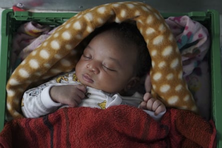 A five-day-old Cameroonian newborn sleeps on a rescue ship in the Mediterranean in 2019.