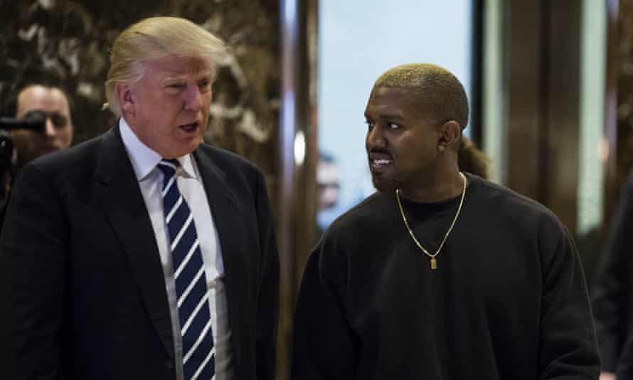 Donald Trump And Kanye West pose for photographers in the lobby of Trump Tower