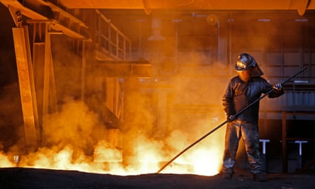 A worker processes liquid steel at the ArcelorMittal factory.