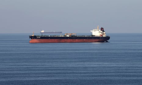 Oil tankers pass through the strait of Hormuz. Despite tensions in the Gulf oil’s price has slided. 