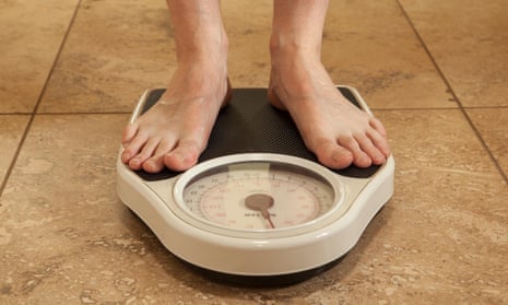 man standing on scales