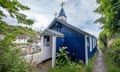 The old prefabricated blue structure of St Mary's Church in the village of Cadgwith, Cornwall.