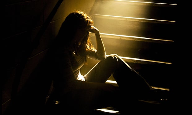 VARIOUSMandatory Credit: Photo by Design Pics Inc/REX (757234a) Depressed girl in stairwell with light streaming in