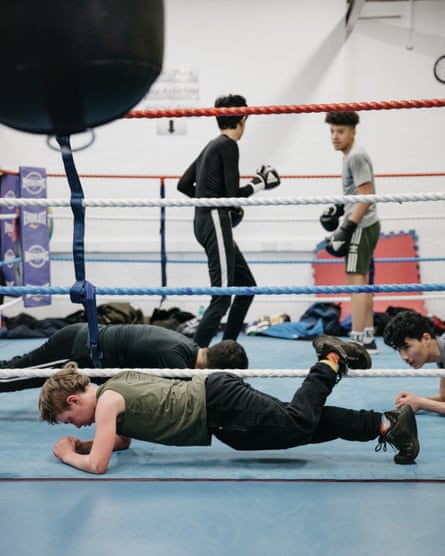 Young people work out in the ring.