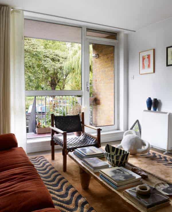 The terrace by the canal next to the living room, with a 70s safari style chair