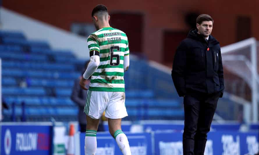 Celtic’s Nir Bitton walks past Rangers manager Steven Gerrard (right) after being sent off.