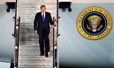 Donald Trump steps off his plane as he arrives at Paya Lebar airbase in Singapore