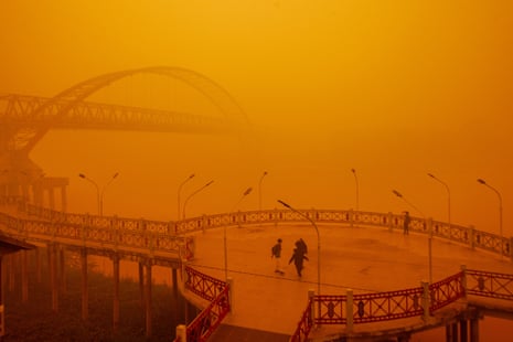 People walk through thick haze from wildfires in Palangkaraya, Central Kalimantan, Indonesia, on Wednesday. Photograph: GENDES/EPA