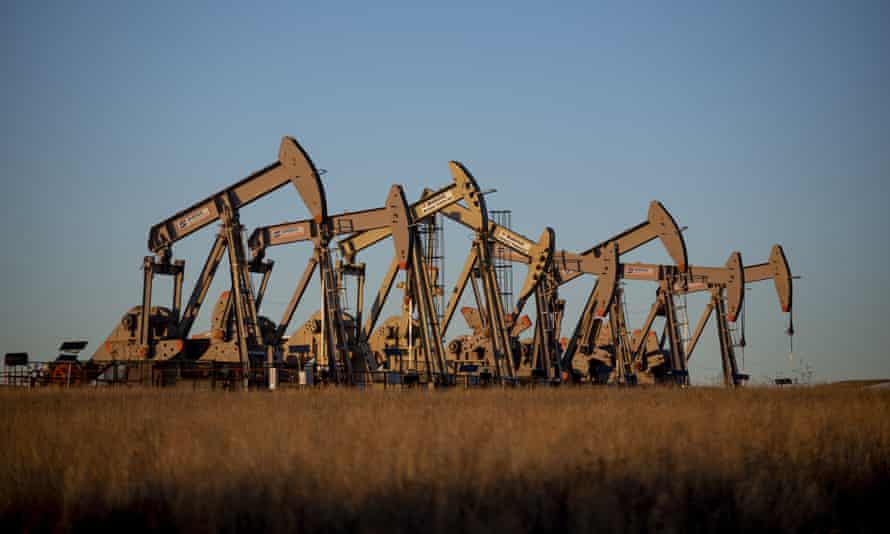 Oil derricks owned by Extraction Oil & Gas pump in Weld County, Colorado.