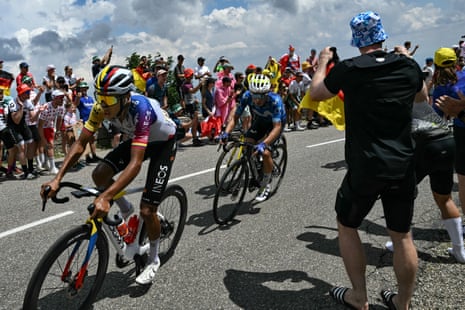 Egan Bernal negotiates the crowds on a descent.