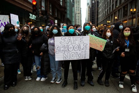 Students gather outside of Chicago public schools headquarters to stage one of several mass Walkouts for Covid Safety at high schools on Friday.